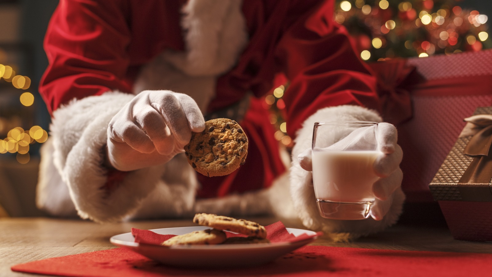 santa,claus,having,a,delicious,snack,,he,is,eating,cookies